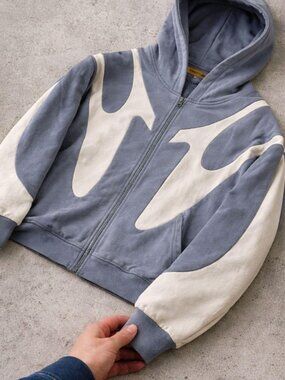 Stylish grey zip-up hoodie with standout design